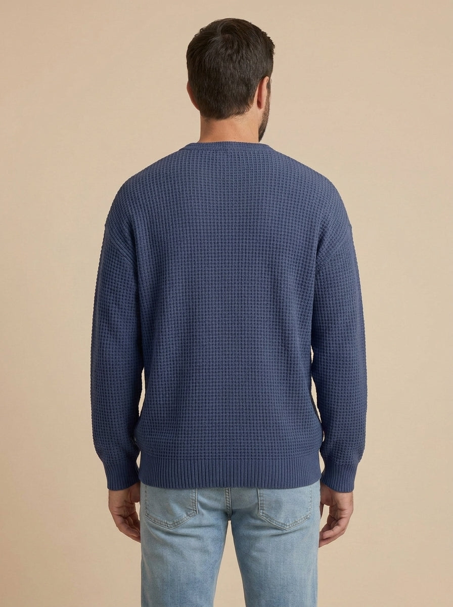 Milo jersey de punto con relieve azul marino, de espaldas